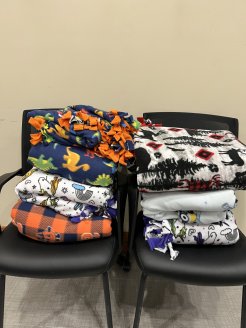 Tie blankets made to benefit members of domestic violence.