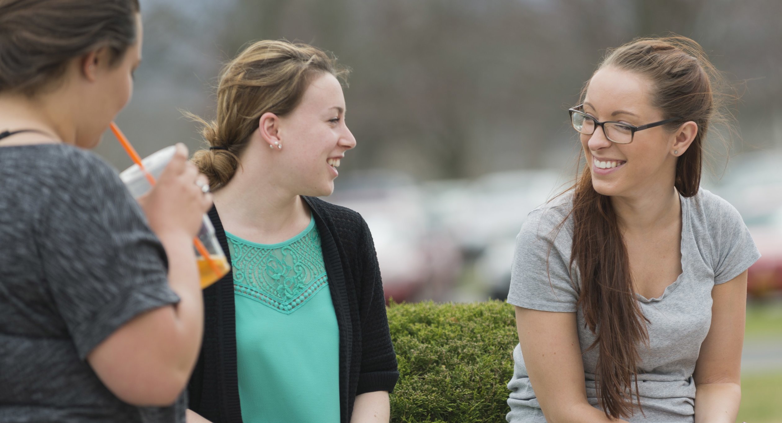 Campus Scenic - Students Talking by bushes - Spring 062