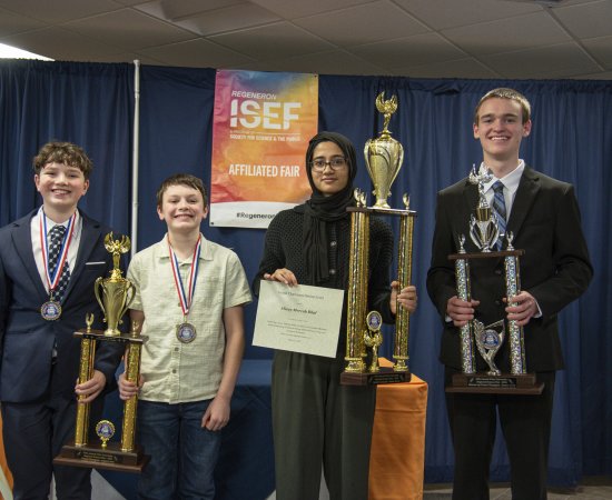 2026 Regional Science Fair Champions stand with their awards.