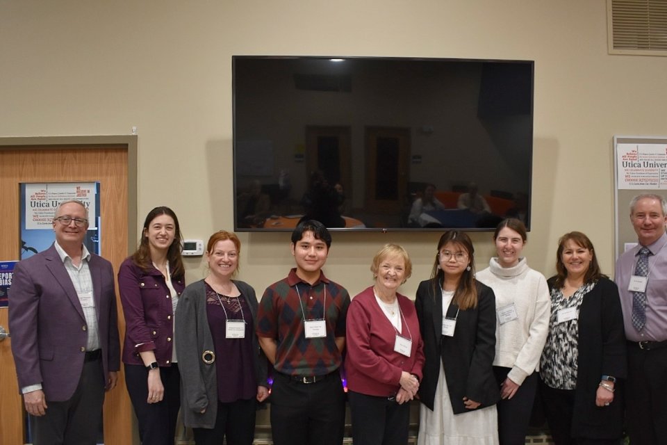 Wilcox Fellows stand with President Todd Pfannestiel and members of the Wilcox Family during the 2024 Wilcox Fellows Reception.